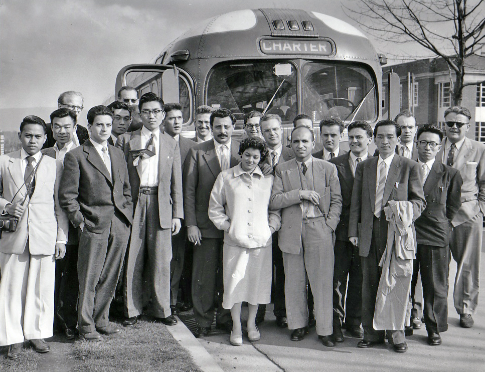 International Scientist photo in front of a bus