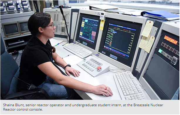 Shaina Blunt, senior reactor operator and undergraduate student intern, at the Breazeale Nuclear Reactor control console.