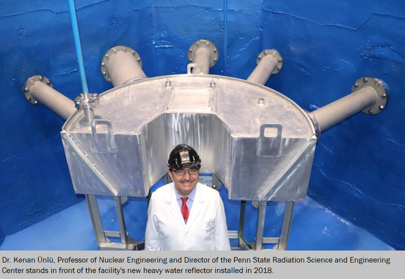 Director Kenan Ünlü, standing in front of the new heavy water reflector as part of the Neutron Beam Lab expansion at the Radiation Science and Engineering Center.